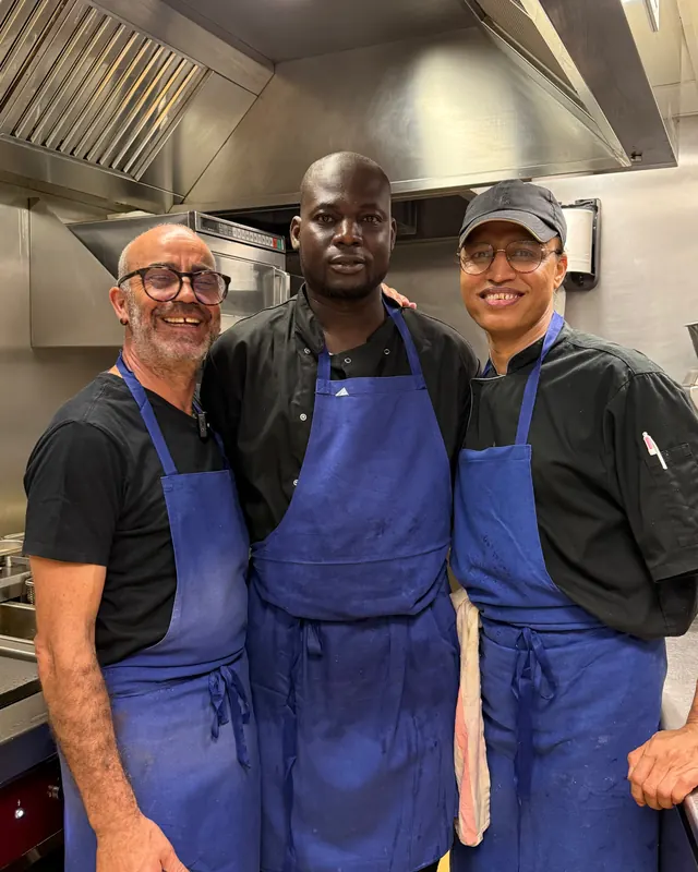 The kitchen team, Blue aprons, noon to midnight